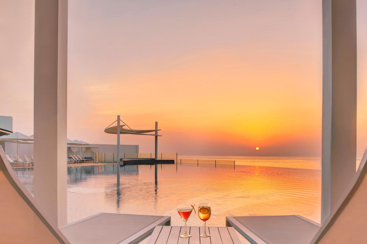 Royal M Al Aqah Beach Resort By Gewan 外观 照片 Sunset at the pool
